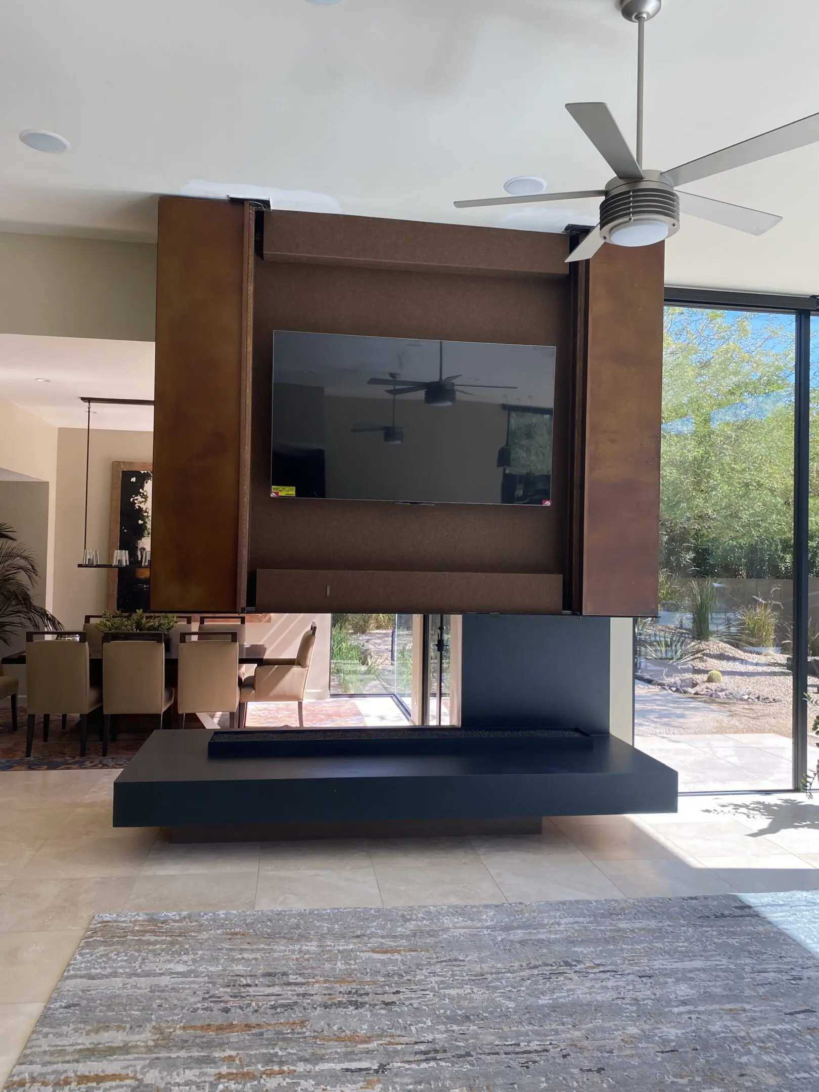 Modern living room with a floating TV and fireplace design.